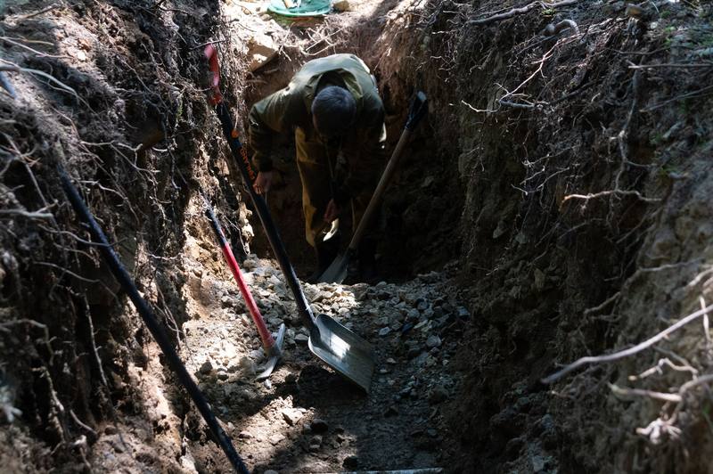 landscaping crew digging trench - Lancaster French Drain